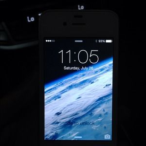 White iPhone 4S black phone case included