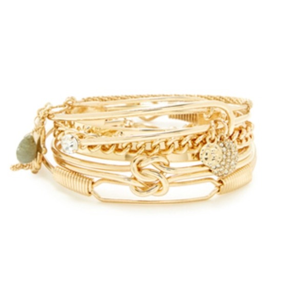 A set of 5 gold and crystal accented bracelets