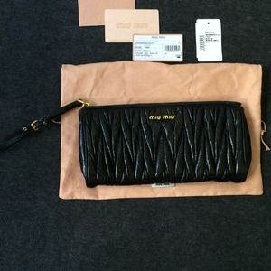 SOLD SOLD 100 % authentic Miu Miu black clutch