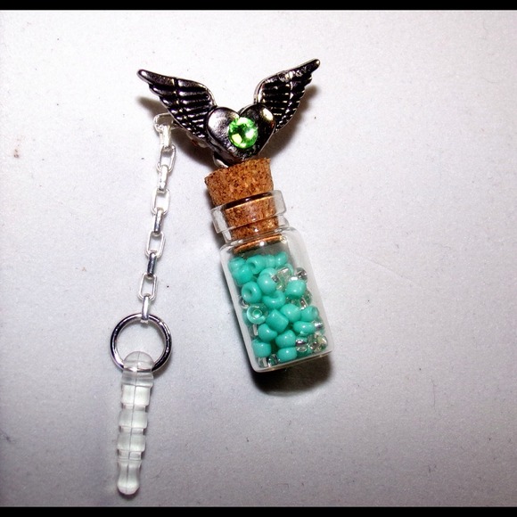 Handcrafted prayer/wish bottle cell dust cover.