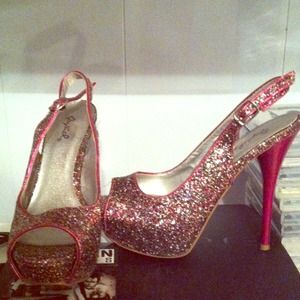 Pink heels with blue, pink, and silver sparkles.