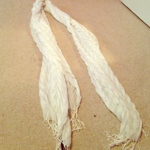 White, shimmery scarf with fringe at the bottom