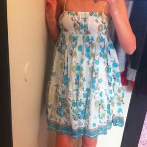 White dress with blue beige and green designs