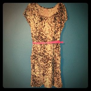 Patterned dress with pink belt.