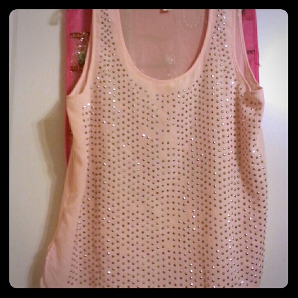 Sheer studded baby pink shirt.