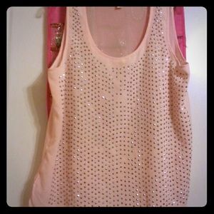 Sheer studded baby pink shirt.