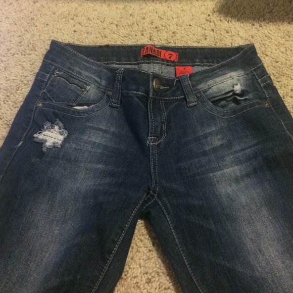 Jeans with rhinestones of a cross on back pocket