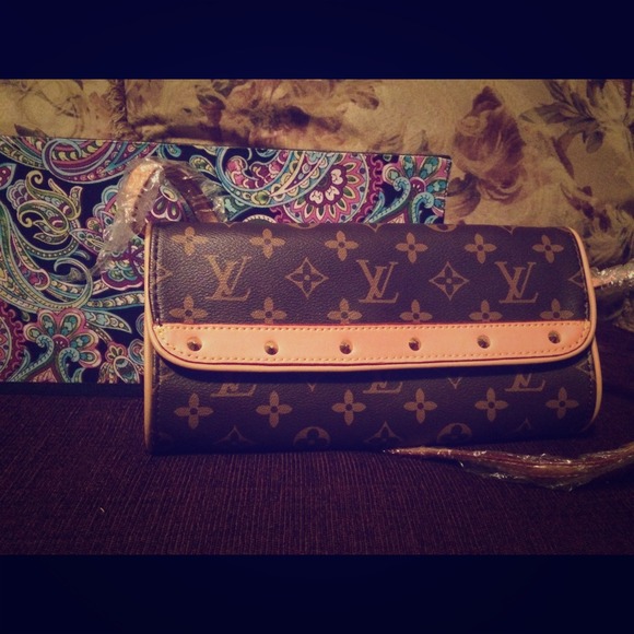 Louis Vuitton clutch (not sure specific name)
