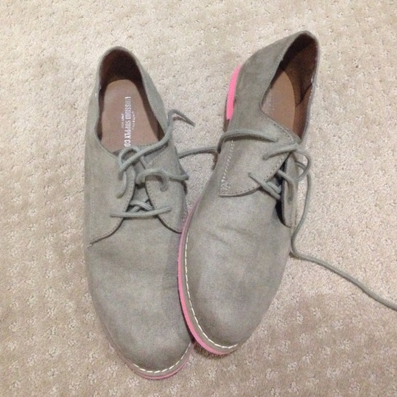 Cute shoes, pink bottoms.