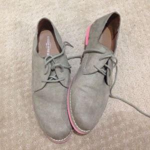 Cute shoes, pink bottoms.