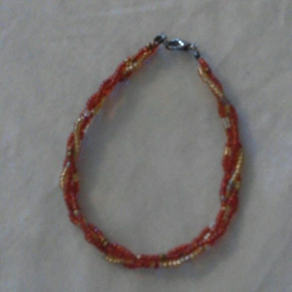 Red w/goled braided bead bracelet
