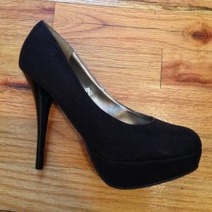 Black suede pumps.