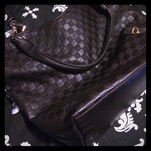 Dark brown leather like bucket bag. Not authentic