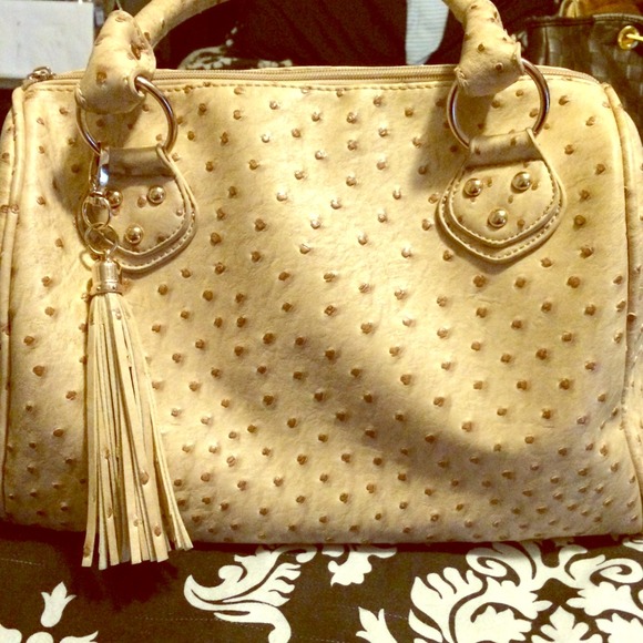 Faux ostrich material speedy style handbag.