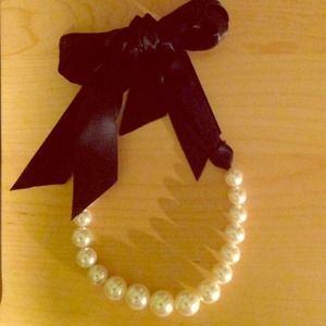 Black silk ribbon and large faux pearl necklace