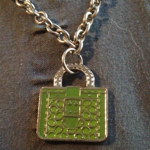 Green Coach pendant on silver chain
