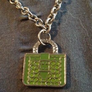 Green Coach pendant on silver chain