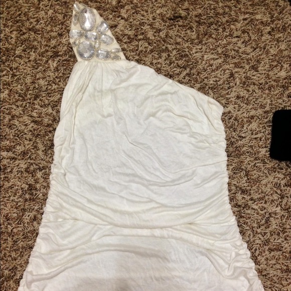 Creme colored one shoulder top with lace back