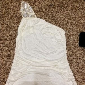 Creme colored one shoulder top with lace back