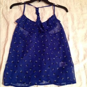 Blue sheer tank top with black and white pattern.