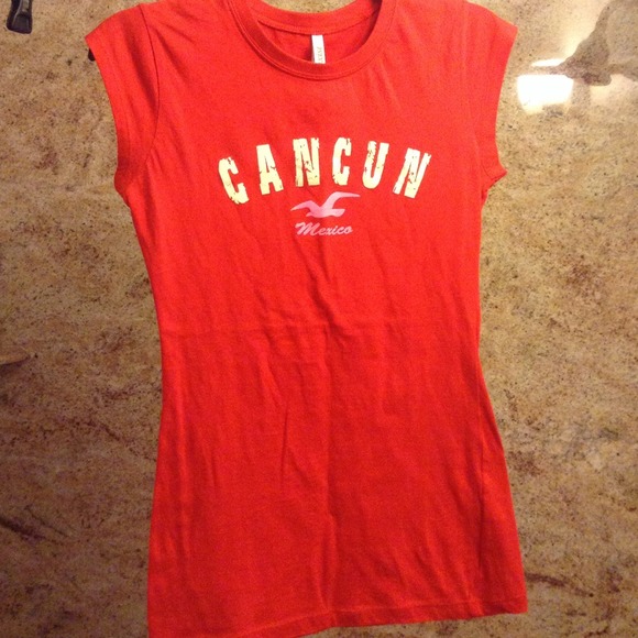 red Cancun shirt.