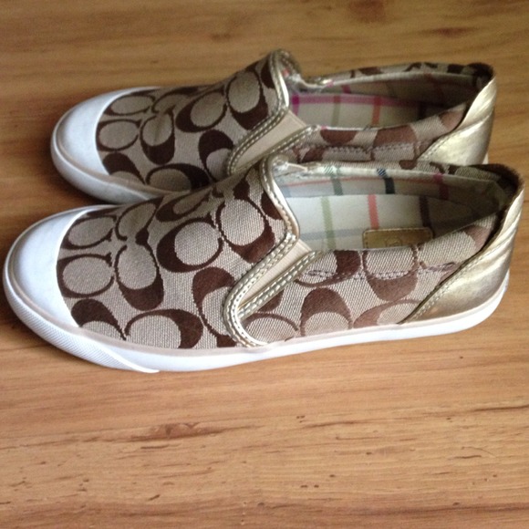 Coach Shoes - COACH LEATHERWARE gold slip on fashion sneakers