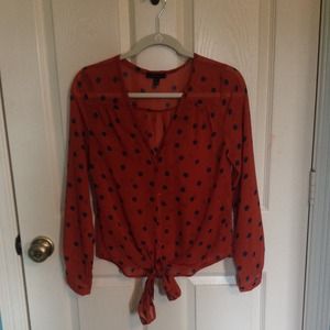 orange blouse with navy blue polkadots