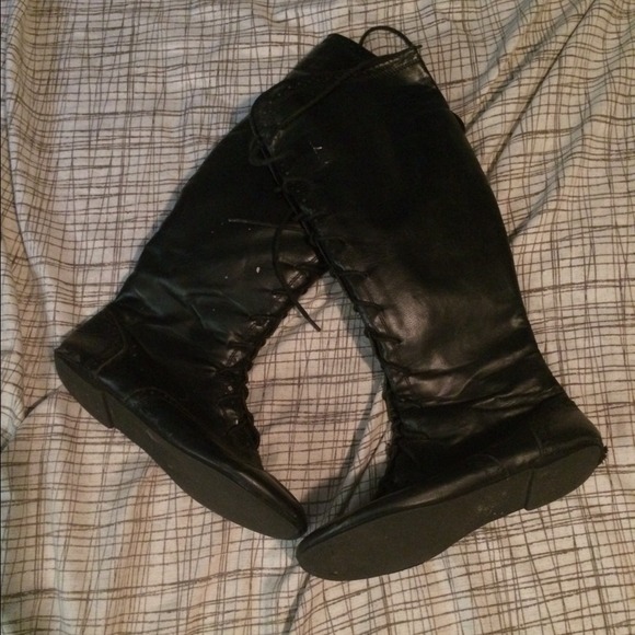 Knee high black boots with laces