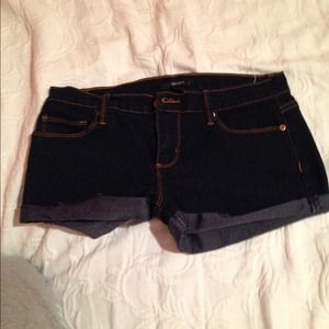 Dark blue jean shorts.