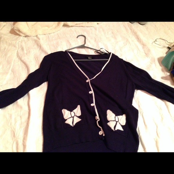 Navy blue and white cardigan.