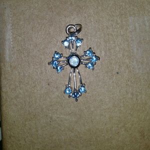 Small sterling silver cross. Aquamarine?