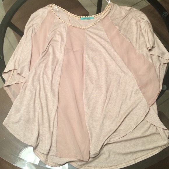Dolman bat wing cream top