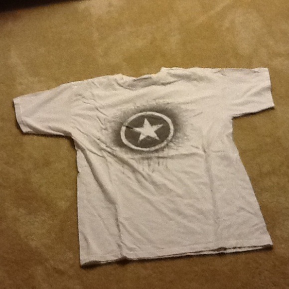 Men white converse tshirt.