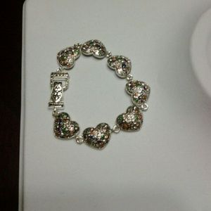 Metal and multi colo bracelet.