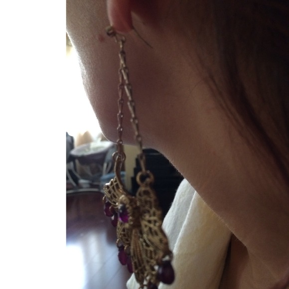 Gold dangling earrings with purple hanging gems. - Picture 3 of 3