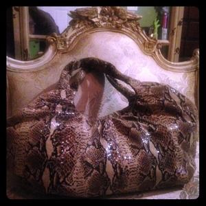 Perlina snake print handbag.