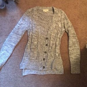 Grey and white knit sweater with elbow patches