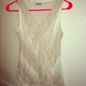 I am selling a white and beige express tank top!