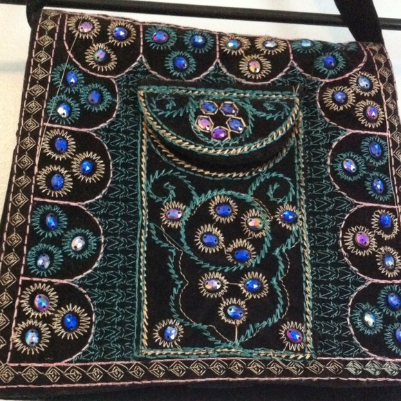 Small felt material black bag w/ designs