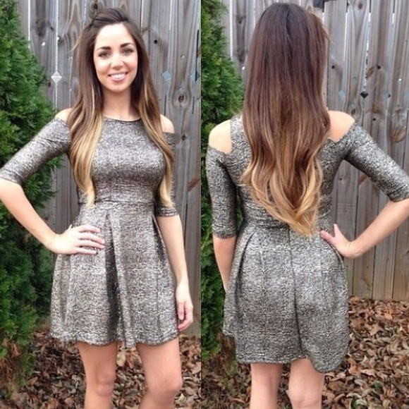 Gold and black metallic like dress with cut outs.