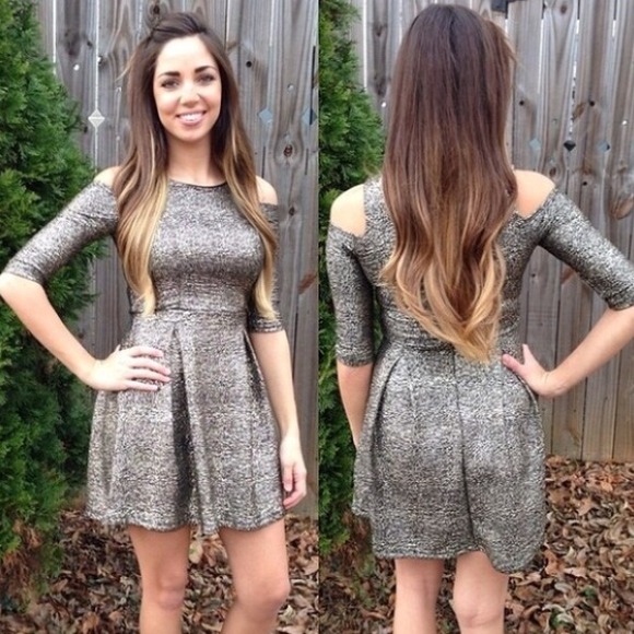 Gold and black metallic like dress with cut outs.