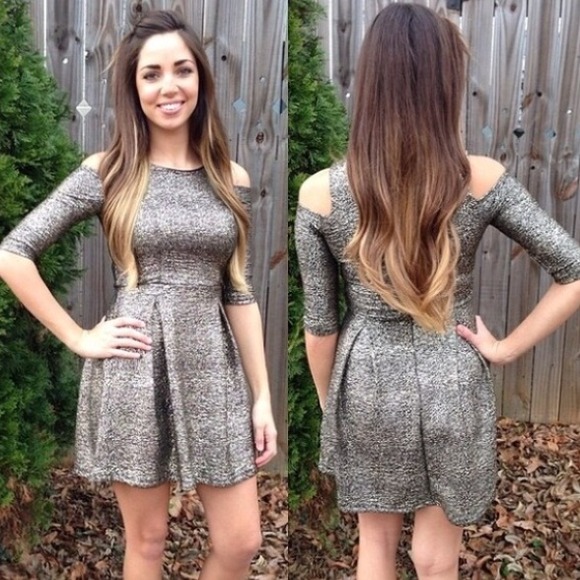 Gold and black metallic like dress with cut outs.