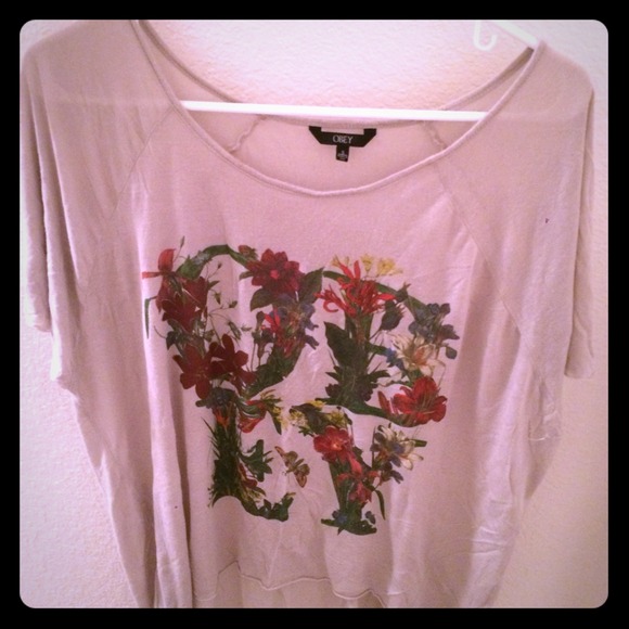 Cream colored "Obey" top