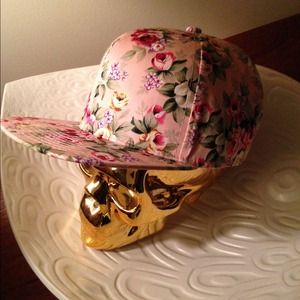 -Trending "snap-back" fun and floral his/hers hat.