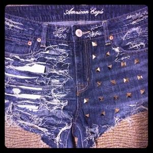 Custom-made distressed & studded cut-off shorts.