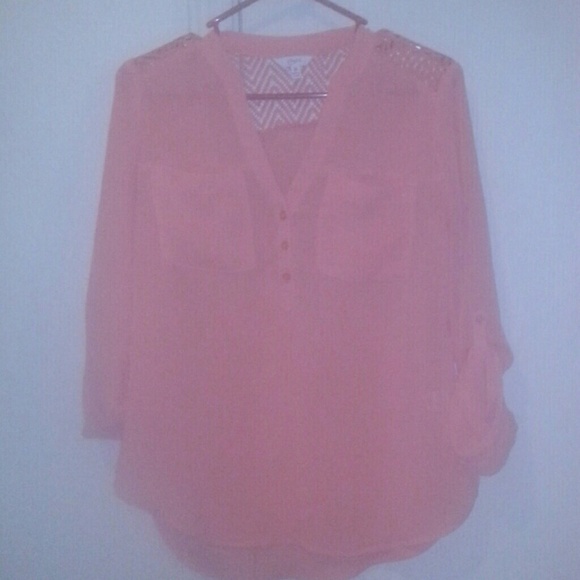Very pretty peach colored half arm shirt.