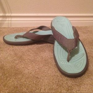 Teal and dark grey crocs flip flops