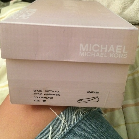 Michael Kors black leather flats.
