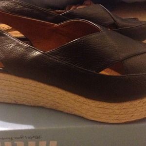 New size 10 black leather wedgie sandal.