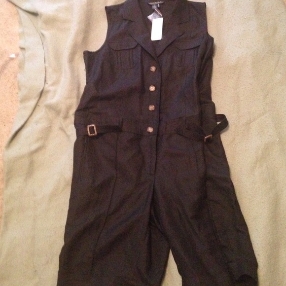 Cute new short romper , sleeveless.